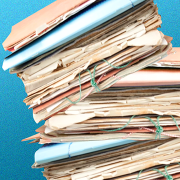 A pile of documents that threatens to topple over